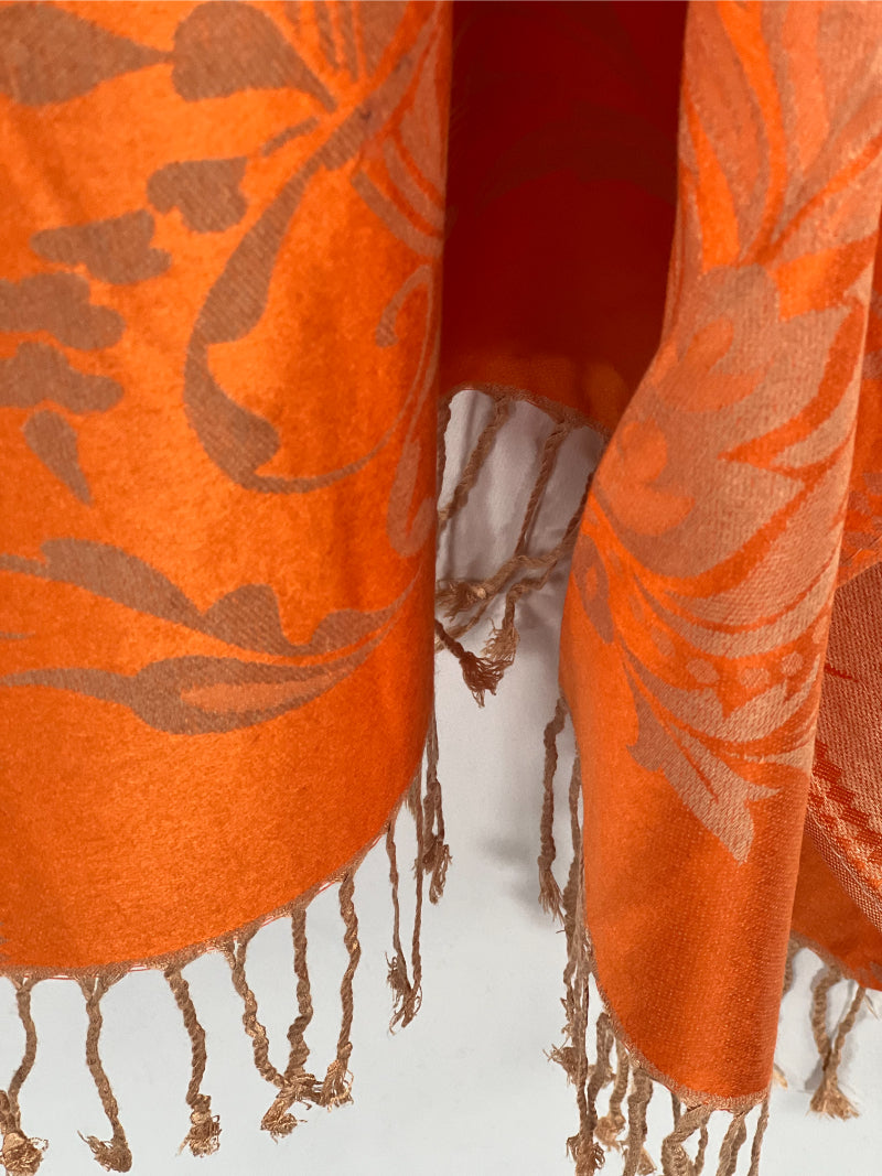 Orange Shawl, Pashmina Wrap, Cream Florals, Fringe Detail, Vibrant Accessory, Elegant Design, Luxurious Feel, Versatile Style, Warm Wrap, Statement Piece, Chic Elegance, Autumn Shawl, Timeless Fashion