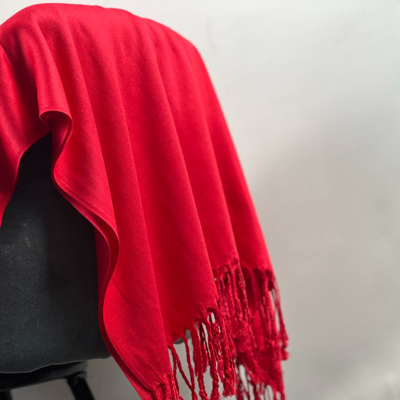 Red Shawl, Pashmina, Cashmere-Feel, Elegant Tassels, Timeless Elegance, Bold Red, Soft Wrap, Luxurious Warmth, Versatile Style, Vibrant Color, Sophisticated Accessory, Quality Craftsmanship, Wardrobe Staple