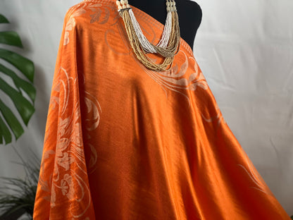 Orange Shawl, Pashmina Wrap, Cream Florals, Fringe Detail, Vibrant Accessory, Elegant Design, Luxurious Feel, Versatile Style, Warm Wrap, Statement Piece, Chic Elegance, Autumn Shawl, Timeless Fashion