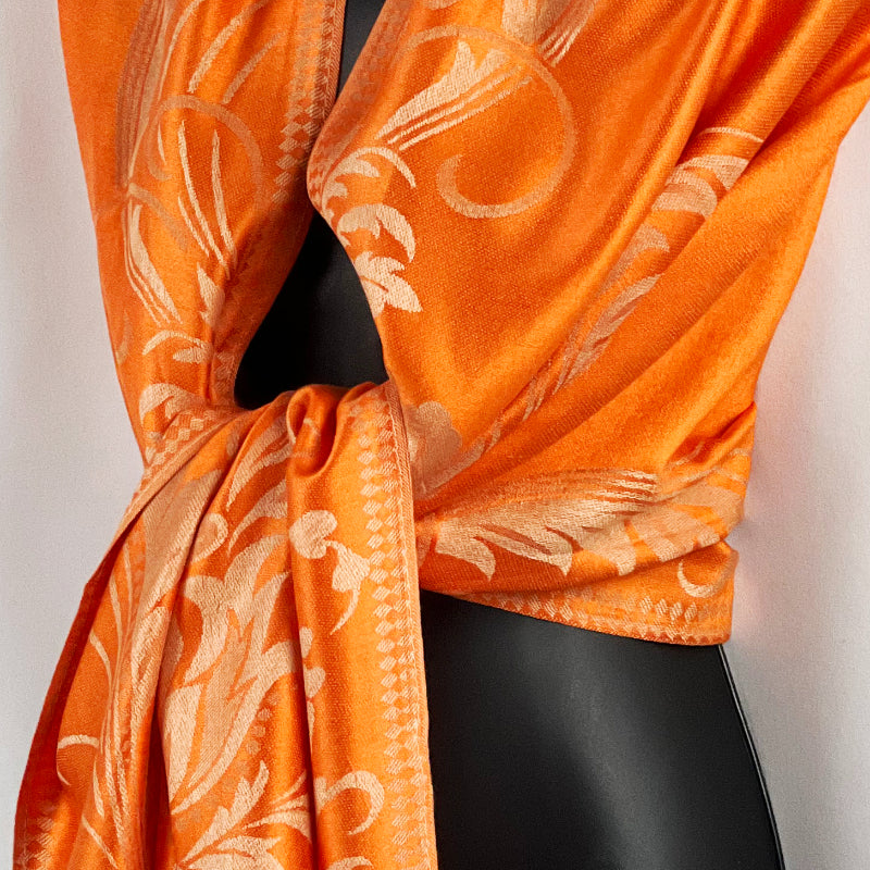 Orange Shawl, Pashmina Wrap, Cream Florals, Fringe Detail, Vibrant Accessory, Elegant Design, Luxurious Feel, Versatile Style, Warm Wrap, Statement Piece, Chic Elegance, Autumn Shawl, Timeless Fashion