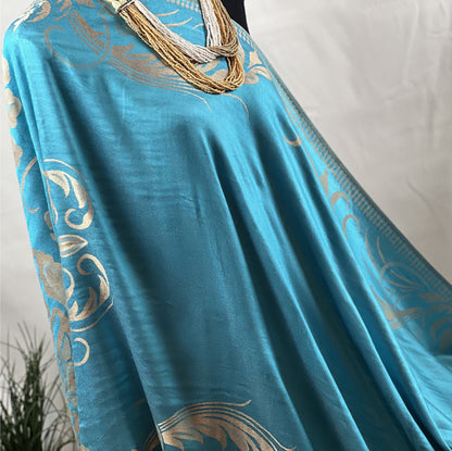 Aqua Pashmina, Gold Detail, Fringed Shawl, Elegant Wrap, Soft Drapery, Luxurious Feel, Chic Accessory, Turquoise Shawl, Metallic Accent, Fashion Scarf, Versatile Wear, Sophisticated, Lightweight Wrap