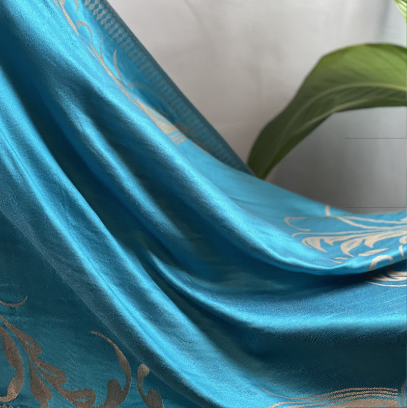 Aqua Pashmina, Gold Detail, Fringed Shawl, Elegant Wrap, Soft Drapery, Luxurious Feel, Chic Accessory, Turquoise Shawl, Metallic Accent, Fashion Scarf, Versatile Wear, Sophisticated, Lightweight Wrap