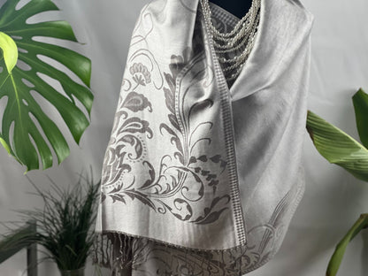 Silver Shawl, Pashmina Wrap, Fringe Detail, Floral Pattern, Elegant Scarf, Soft Accessory, Gray Embroidery, Luxe Drapery, Chic Cover-up, Winter Fashion, Sophisticated, Timeless Style, Versatile Wear