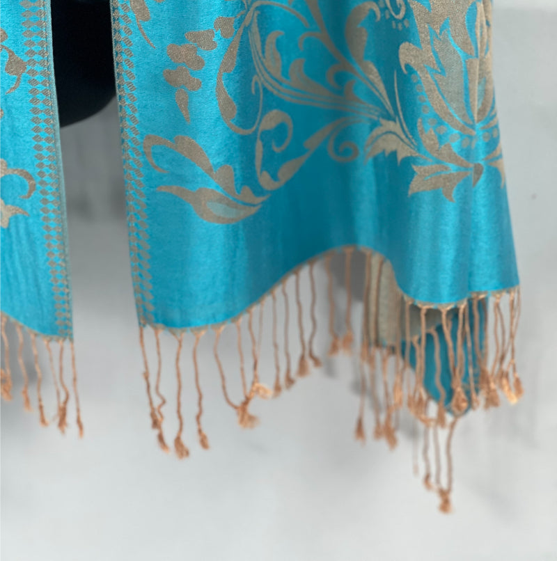 Aqua Pashmina, Gold Detail, Fringed Shawl, Elegant Wrap, Soft Drapery, Luxurious Feel, Chic Accessory, Turquoise Shawl, Metallic Accent, Fashion Scarf, Versatile Wear, Sophisticated, Lightweight Wrap