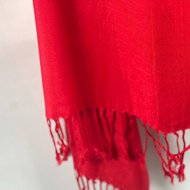 Red Shawl, Pashmina, Cashmere-Feel, Elegant Tassels, Timeless Elegance, Bold Red, Soft Wrap, Luxurious Warmth, Versatile Style, Vibrant Color, Sophisticated Accessory, Quality Craftsmanship, Wardrobe Staple