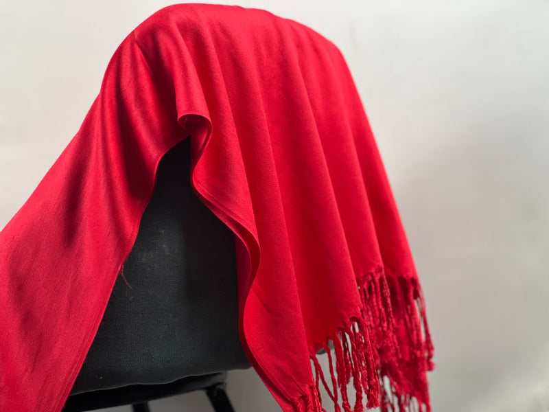 Red Shawl, Pashmina, Cashmere-Feel, Elegant Tassels, Timeless Elegance, Bold Red, Soft Wrap, Luxurious Warmth, Versatile Style, Vibrant Color, Sophisticated Accessory, Quality Craftsmanship, Wardrobe Staple